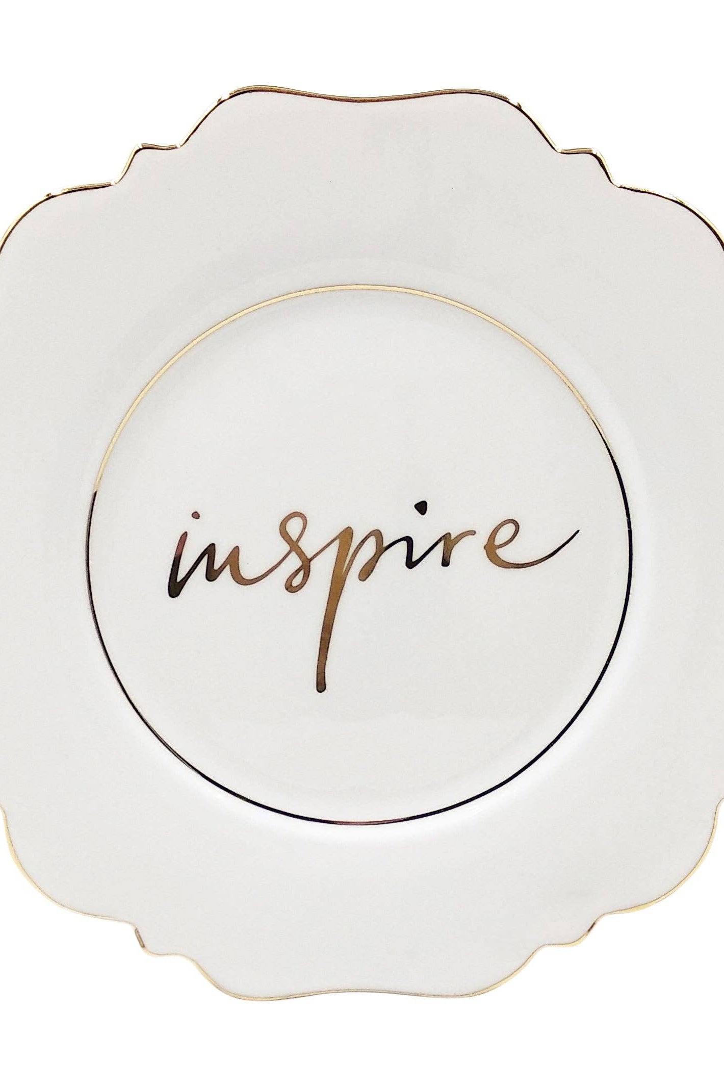 Decorative plate with 'inspire' text on a white background
