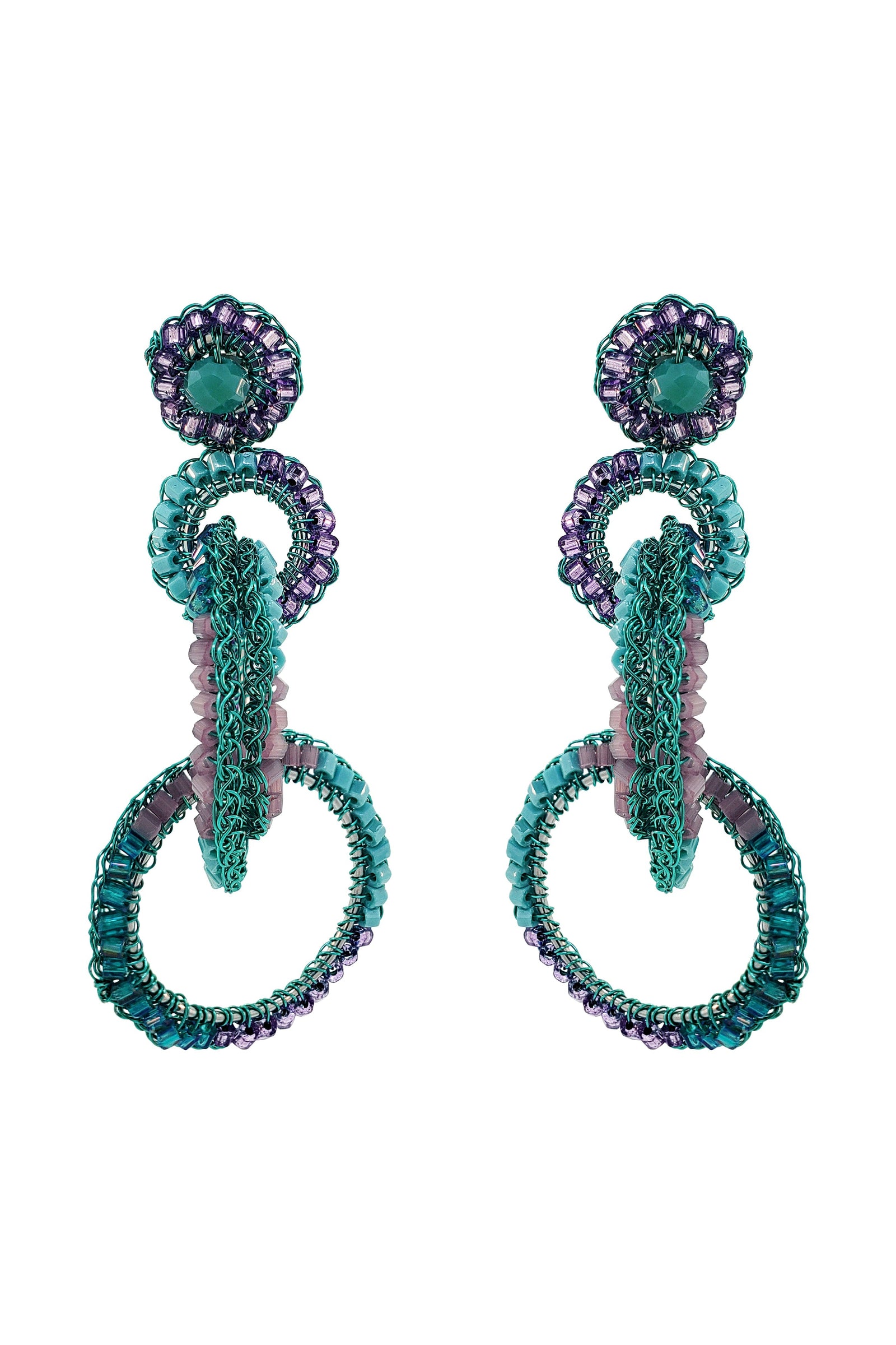 Pair of earrings with intricate design on a white background