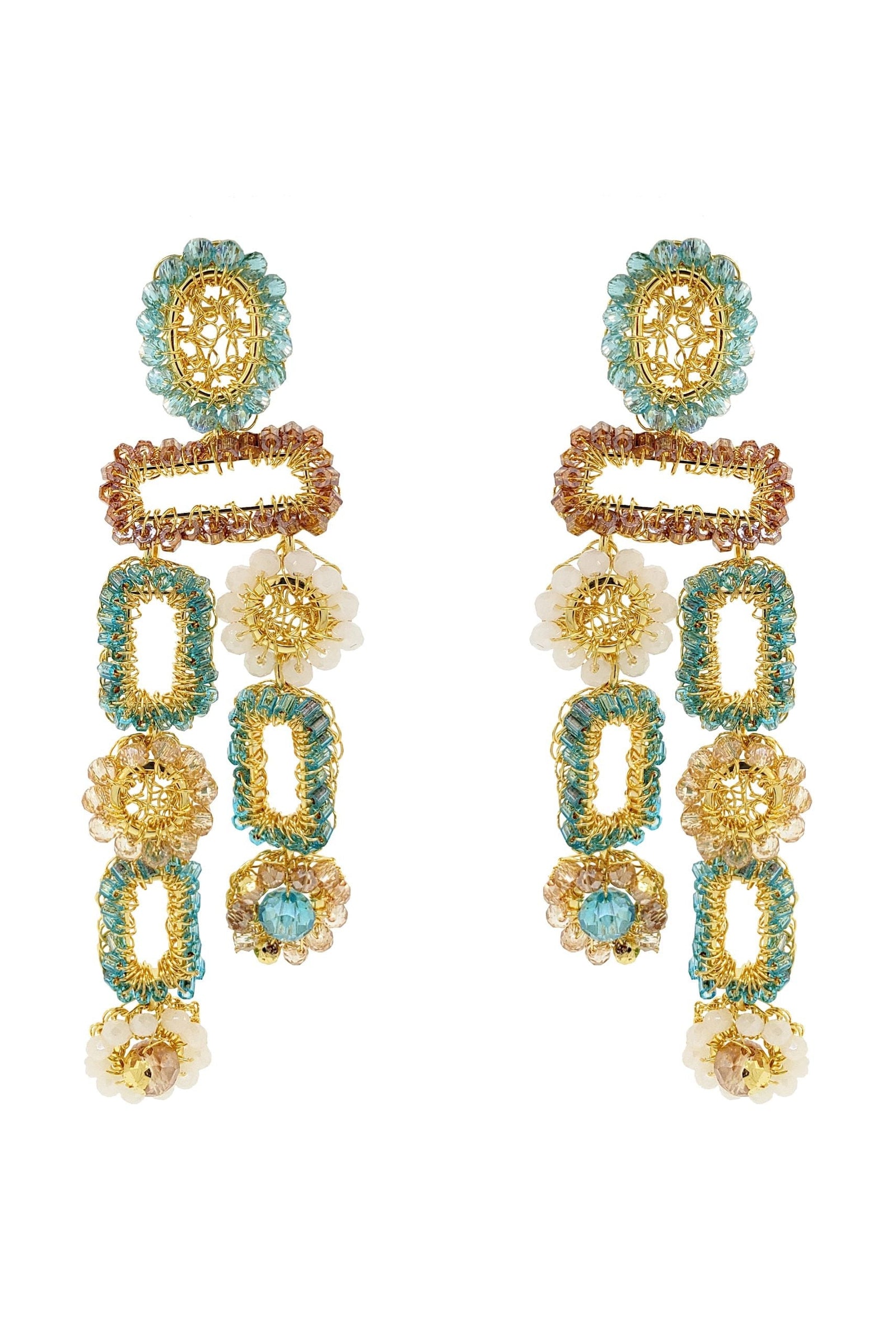 Pair of gold and turquoise earrings on a white background