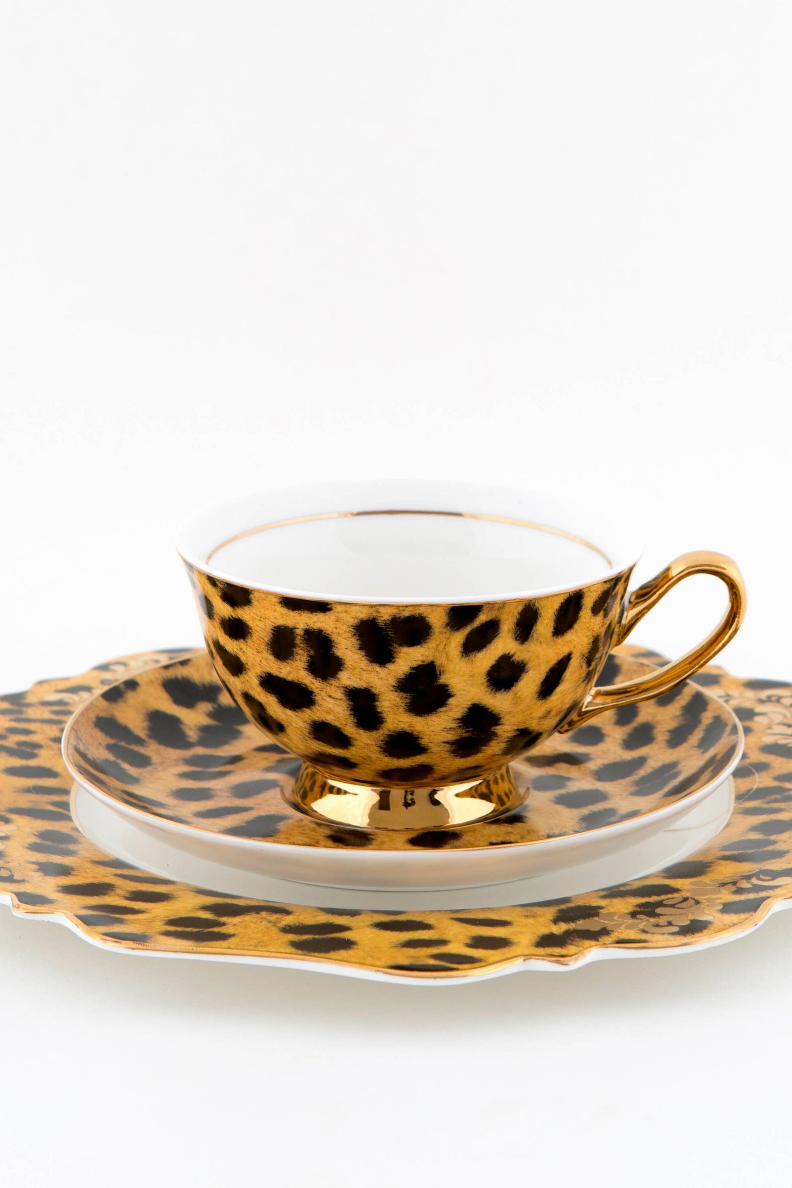 Leopard print decorative plate with 'Wild at heart' text on a white background