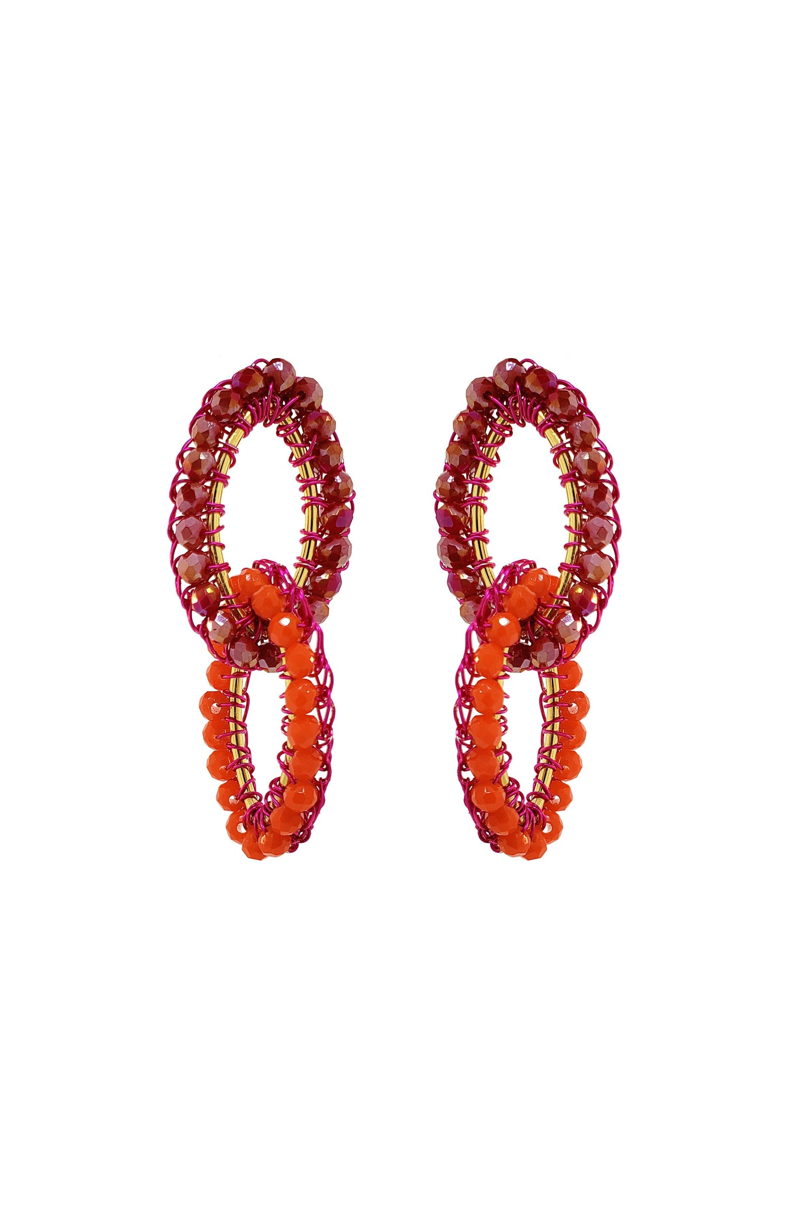 Pair of beaded earrings with red and orange beads on a white background