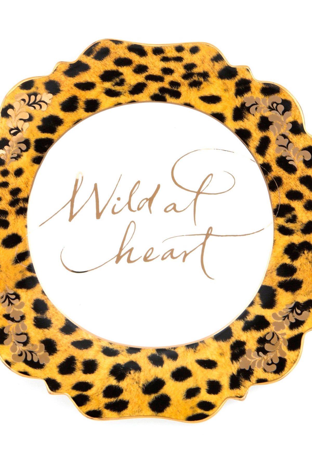 Leopard print decorative plate with 'Wild at heart' text on a white background