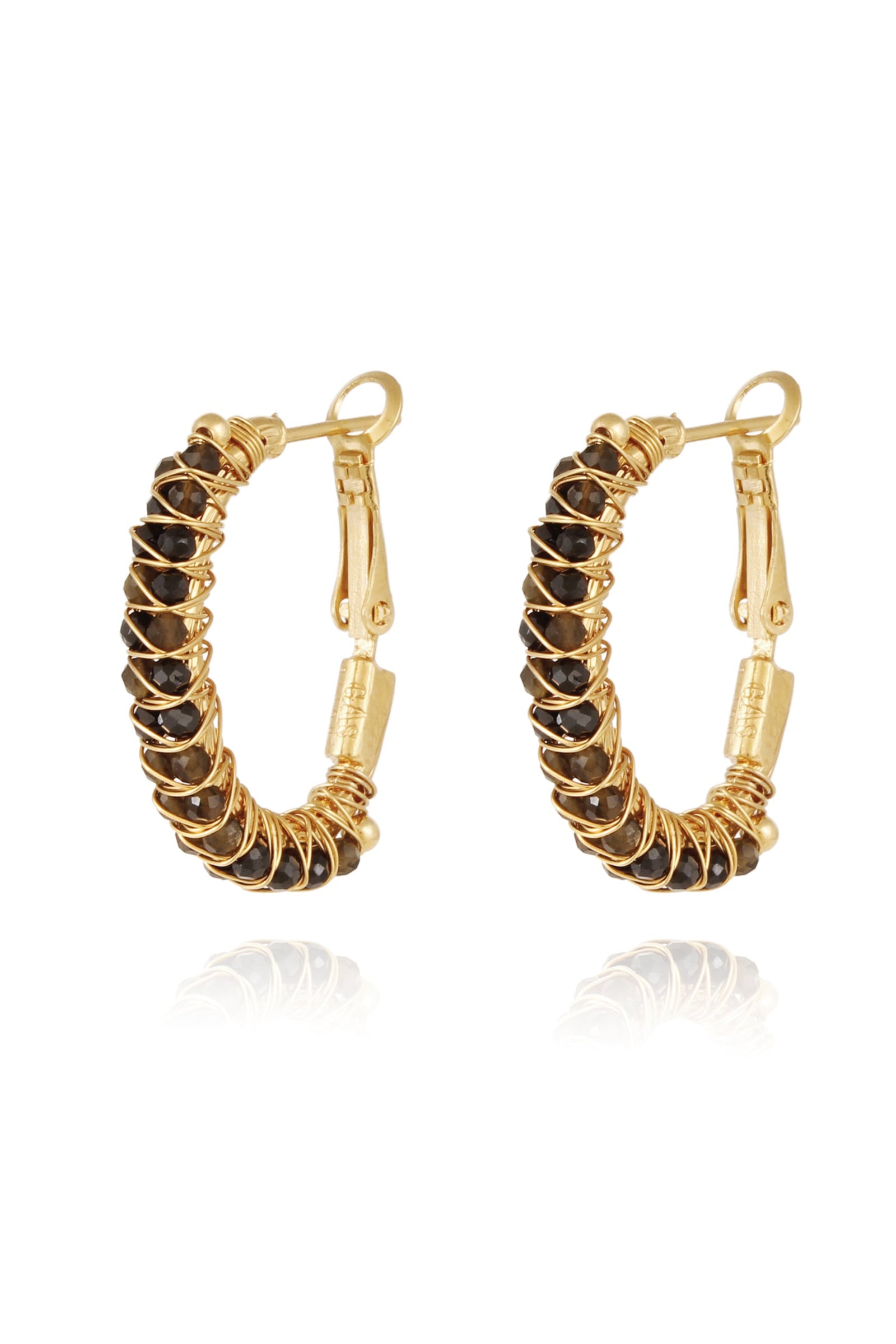 This image displays a pair of lyre hoop earrings, designed with elegance and simplicity. The earrings feature small, circular lyre beads strung along a thin, gold-tone hoop.