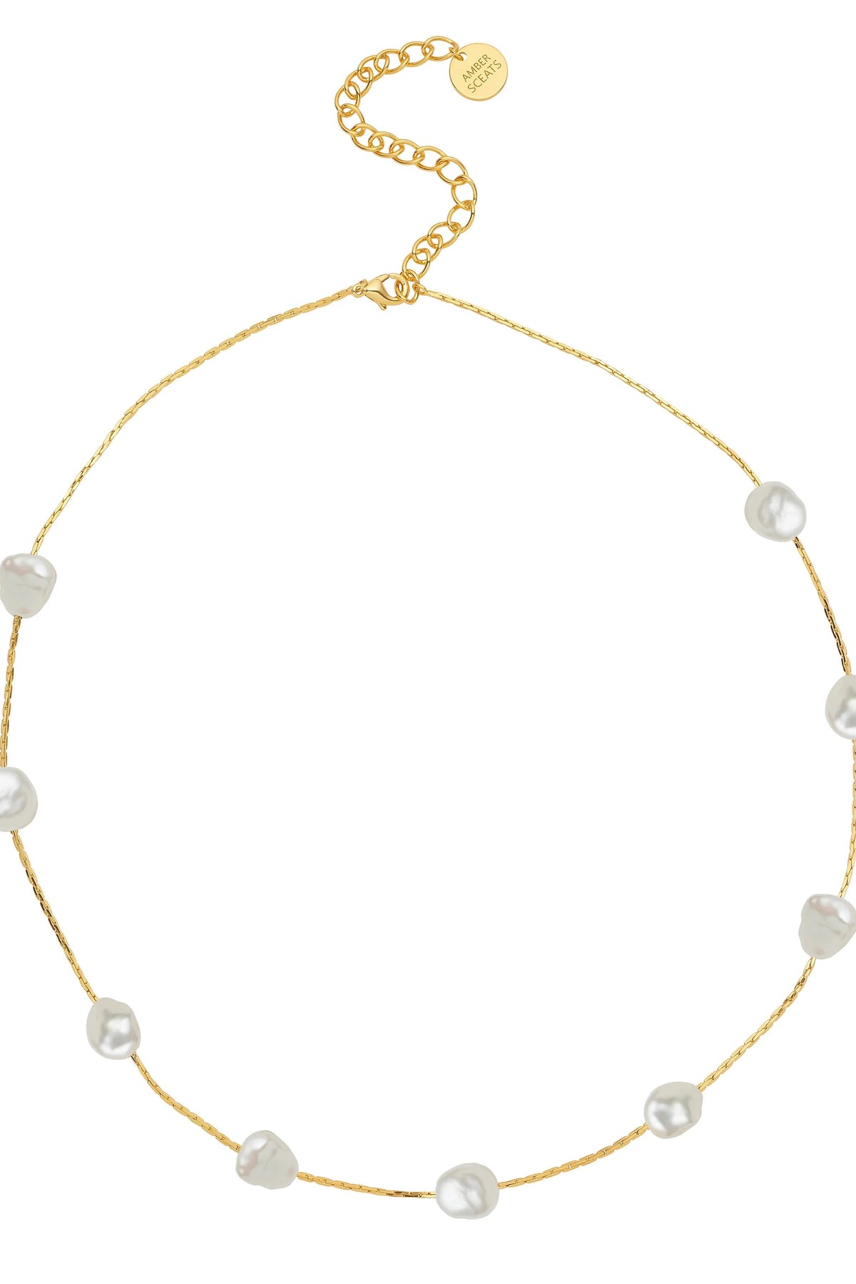 Gold necklace with pearls on a white background