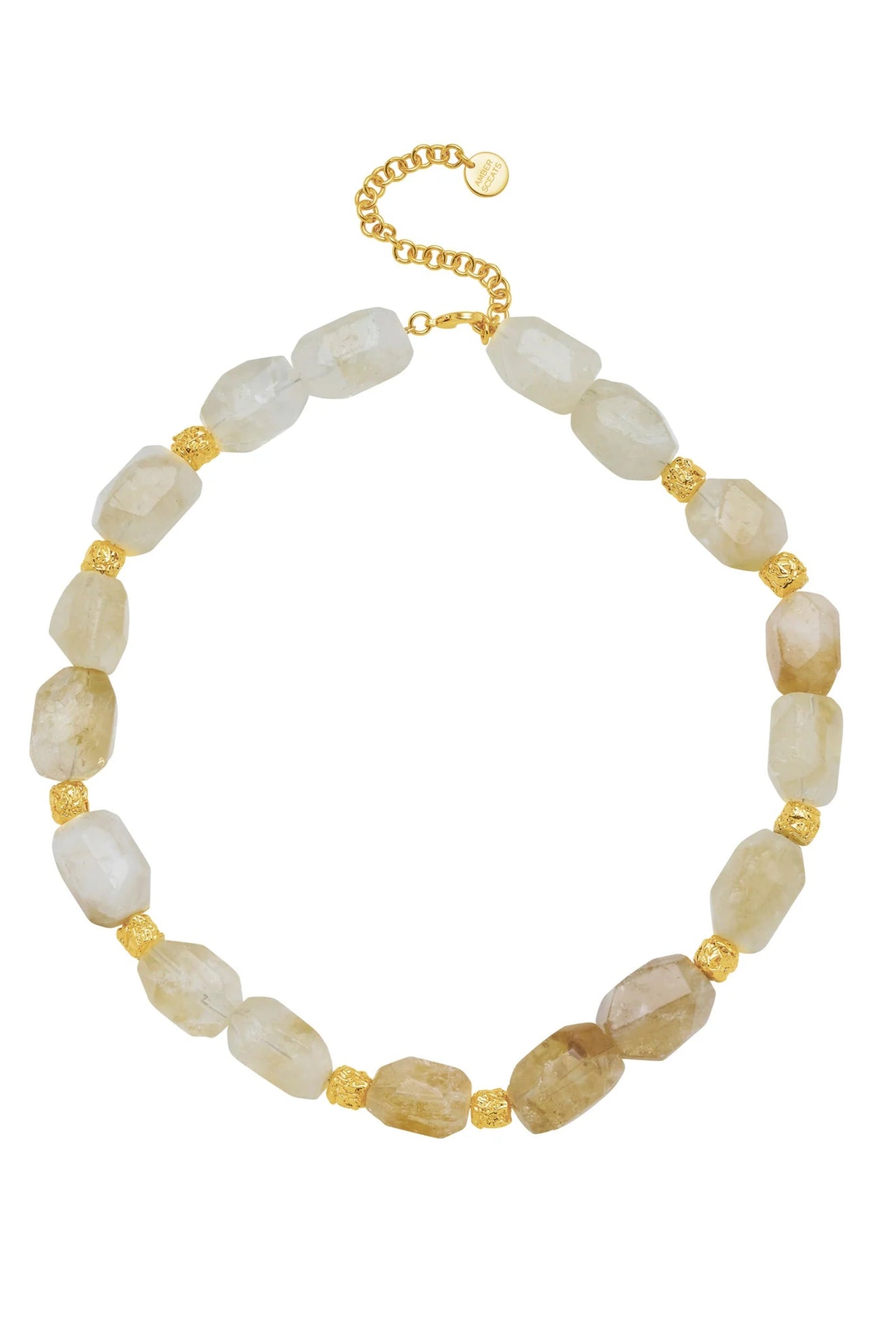 Necklace with beige beads and gold accents on a white background
