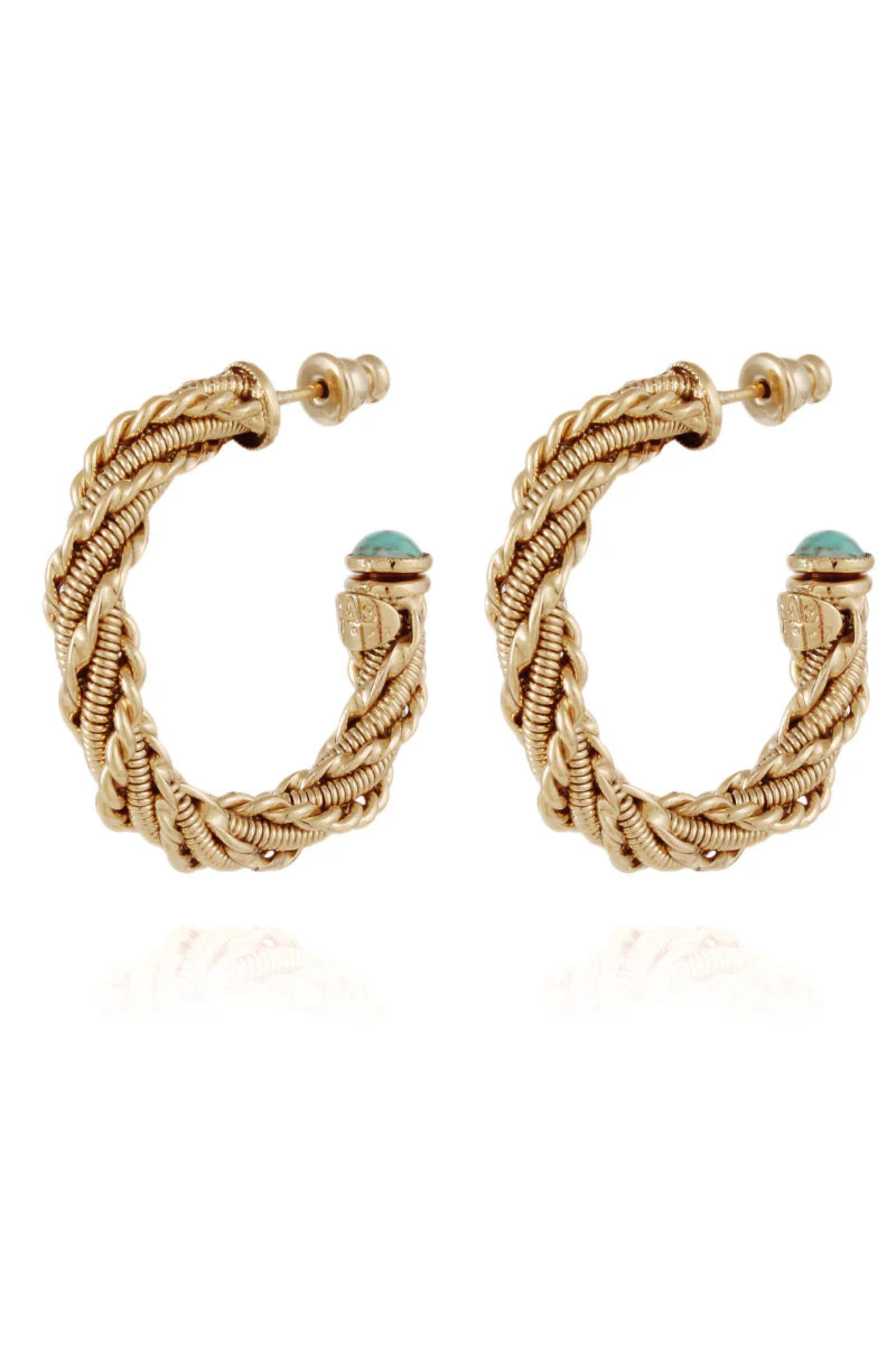 A pair of gold-plated hoop earrings with twisted design and blue cabochons, displayed against a white background.