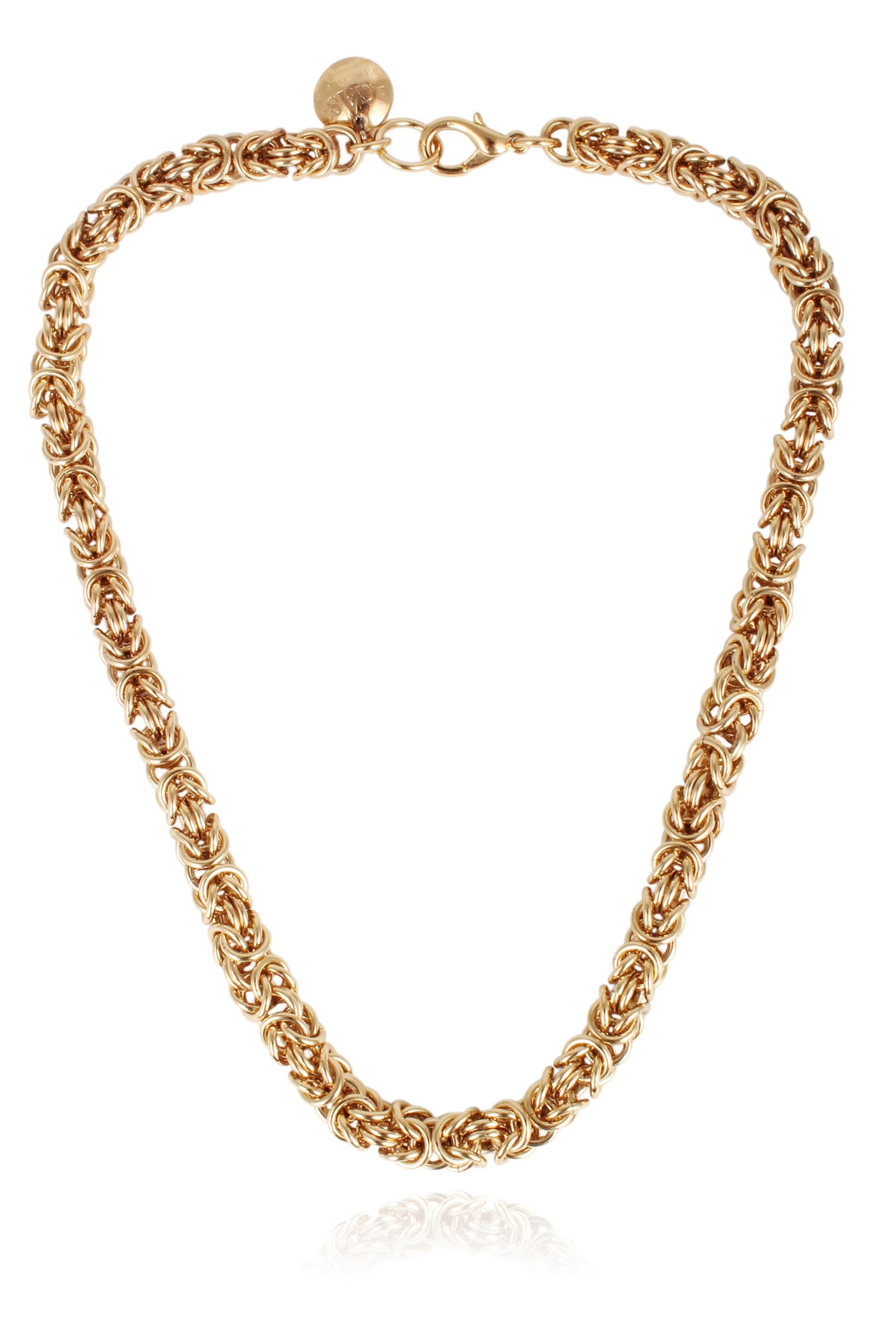 This image displays the Claude O Necklace, featuring an intricate and elegant gold-tone chain. The necklace is designed with a robust and textured link chain that enhances its luxurious appeal.