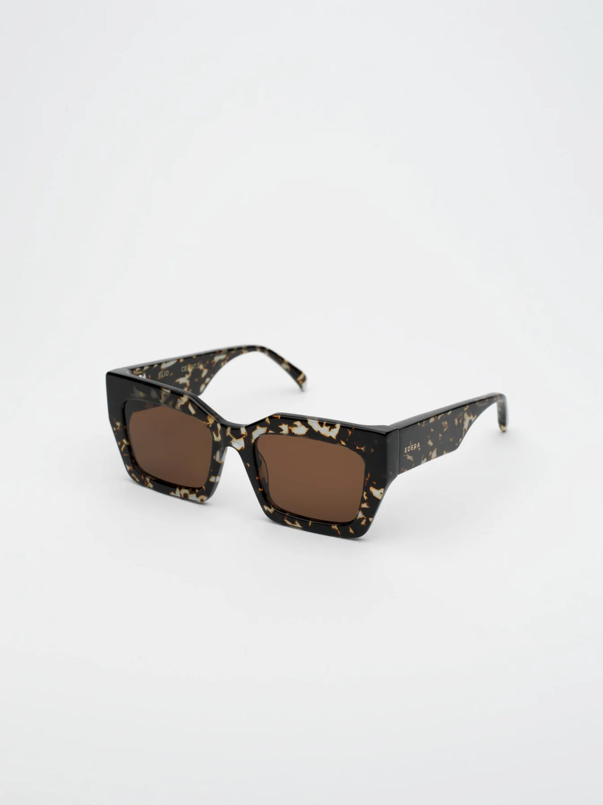 Sunglasses with a black and gold frame on a white background