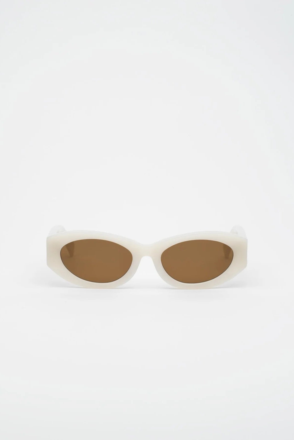 Woman wearing white sunglasses with a neutral background