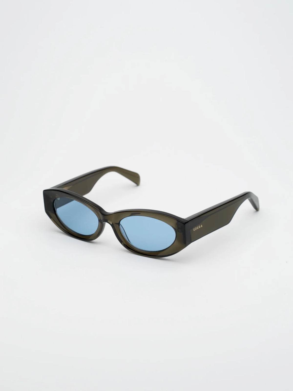 Sunglasses with a green frame and blue lenses on a white background
